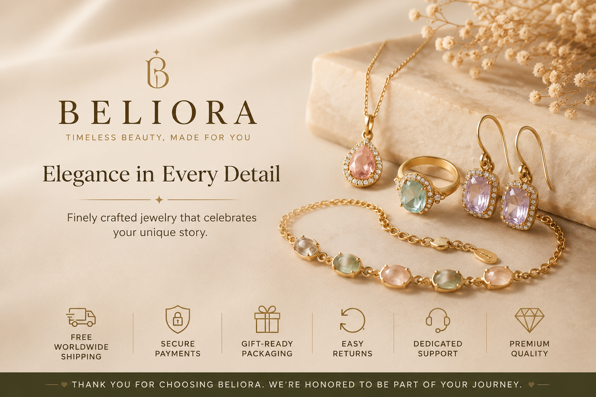 BELIORA jewelry set featuring a gold necklace, ring, earrings, and bracelet with pastel pink, green, and lavender gemstones, styled on a beige fabric background with decorative dried flowers and a stone slab.